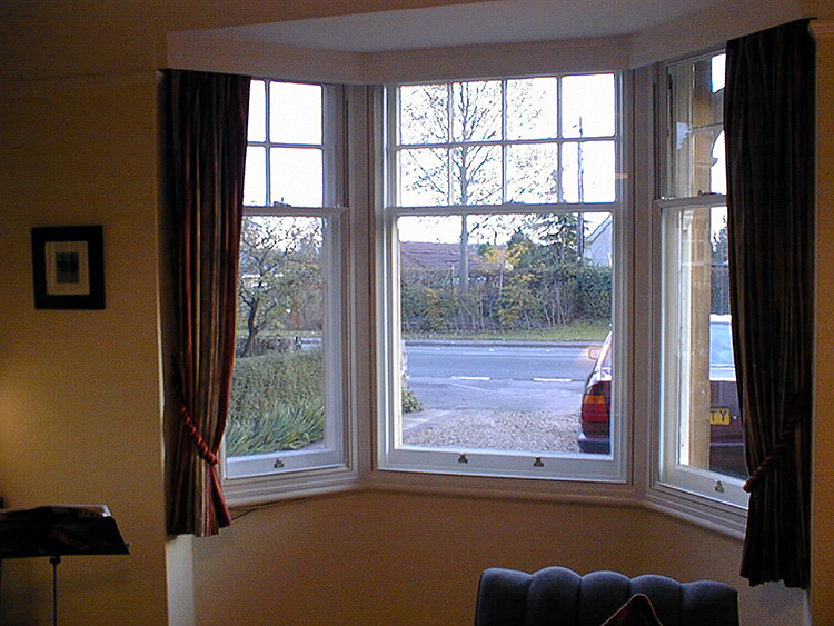 Made-to-measure secondary glazing fitted around a bay window